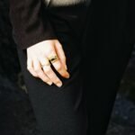 a woman's hand with a ring on it